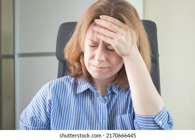 Cerebral Ischemia, Migraine, Headache, Woman Holds Her Head With Her Hand