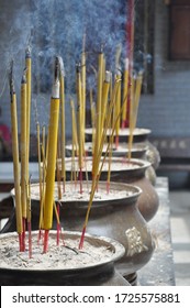 Ceremonial Incense Sticks On A Temple In Huè, Vietnam.