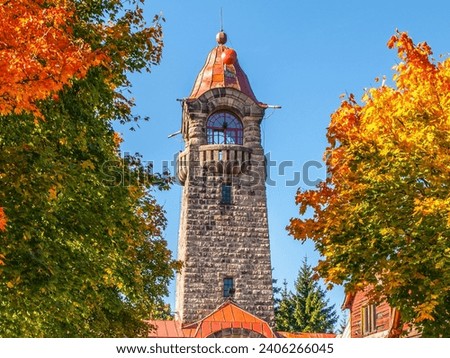 Cerna Studnice - stone lookout tower in Jizera Mountains, Czech Republic. Sunny autumn day.