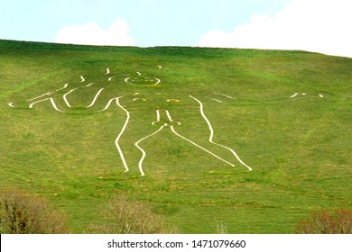  Cerne Abbas Dorset England May. The Cerne Abbas Giant. Hill figure carved out of chalk. 55 meters high. Depicts a standing nude male with prominent manhood welding a club. Origins unknown 