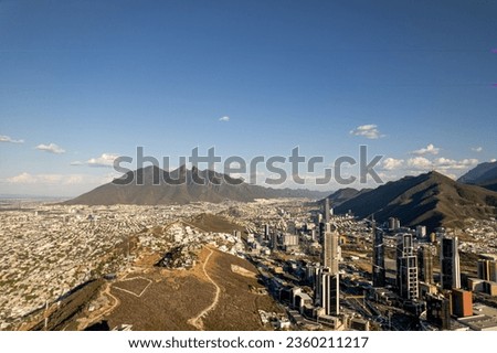 Cerro de la Silla during sunset in Monterrey, Mexico with the view of the financial and corporate buildings 