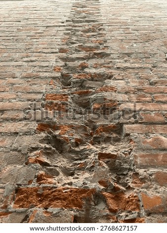 A certain broken brick pillar wall