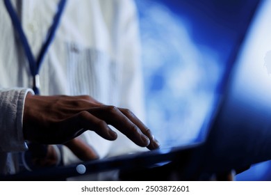 Certified engineer writes code on laptop to visualize artificial intelligence neural networks using augmented reality technology, close up. Data center expert runs AI script for information processing