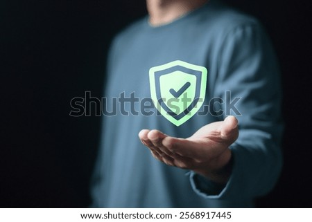 Certified guarantee approval and secure access system concept, Business Financial Warranty for Investment. Businessman holding shield with check mark on virtual screen. 