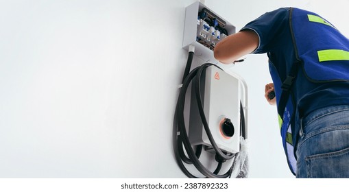 Certified male Electrician Installing Home EV Charger - Powered by Shutterstock