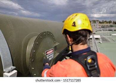 Certifier Maintenance Construction Worker Wearing Black Safety Glove Full Body Safety Harness Helmet Conducting Safety Inspection On Confined Space Manhole Sign Prior To Work Entry Restricted Area 