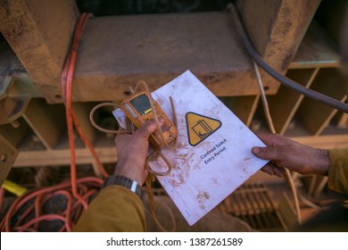 Certifies Miner Hands Holding Gas Test Detector Confined Space Permit Book And Inspecting Safety Environment Surrounding Before Conduct Gas Testing Atmosphere Prior Entry To Work Perth, WA