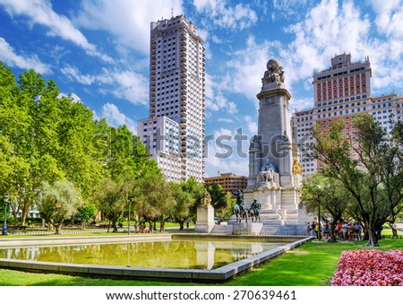 The Cervantes monument, the Tower of Madrid (Torre de Madrid) and the Spain Building (Edificio Espana) on the Square of Spain (Plaza de Espana). Madrid is popular tourist destination of Europe.