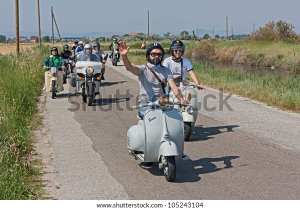 CERVIA (FC) ITALY - JUNE 6: A group of bikers\
riding italian scooters and motorbikes at \