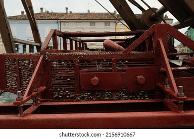 CESENATICO, ITALY - Apr 01, 2022: A Red Metal Structure In A Port On A Gloomy Day