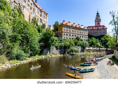 Cesky Krumlov Castle with Tower and rafting on Vltava river, Czech Republic