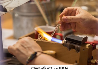 Cesky Krumlov, Czech Republic - August 17, 2017: Craftsman Works A Glass Object With A Flame In The Historic City Center