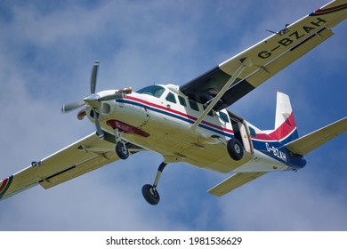 Cessna 208b Grand Caravan G-BZAH light aircraft returning to land after dropping the Red Devils parachute display team on a practice jump 