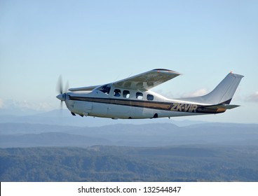 Cessna 210 Light Aircraft Flying Over Westland, New Zealand