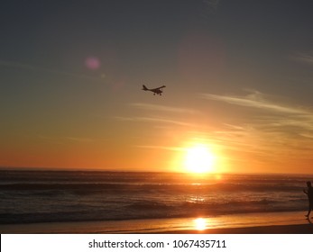 Cessna Flying Over Beach Sunset 