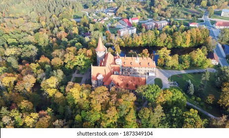 Cesvaine Medieval Castle in Latvia  From Above Top View. A Manor House of the Late 19th Century, a Building of Stones With a Brown Tiled Roof. Cesvaine Palace in Beautiful Autumn Day. Aerial Dron Shot - Shutterstock ID 1873349104