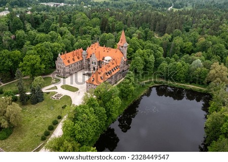 Cesvaine medieval castle in Latvia from above, top view. A manor house of the late 19th century.