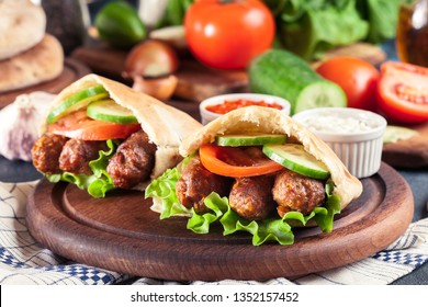 Cevapcici or cevapi served with pita bread and vegetables