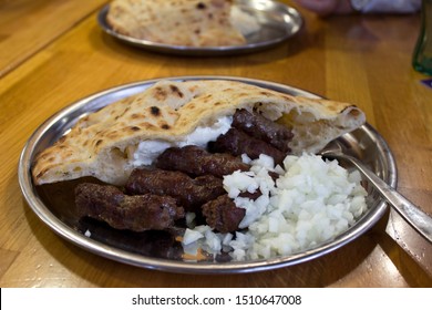 cevapi ( Ćevapi) Bosnian traditional food with kajmak and onion