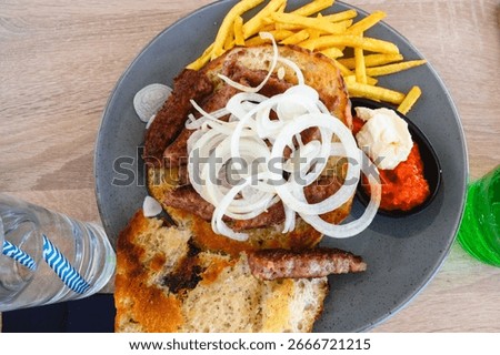 Cevapi also called Cevapсici - small sausages from chopped pork and beef with spices. Very popular dish in the Balkan countries
