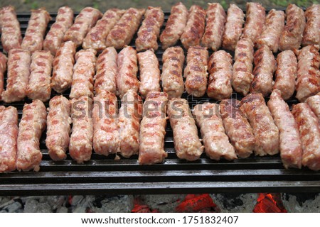 Cevapi on charcoal grill.Delicious serbian food.