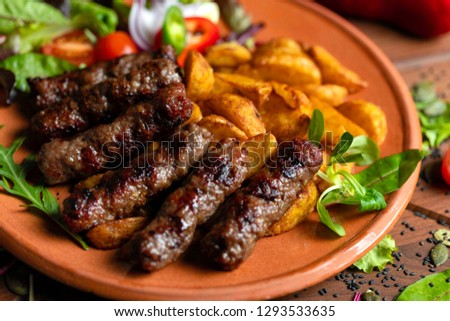 Cevapi with potatoes