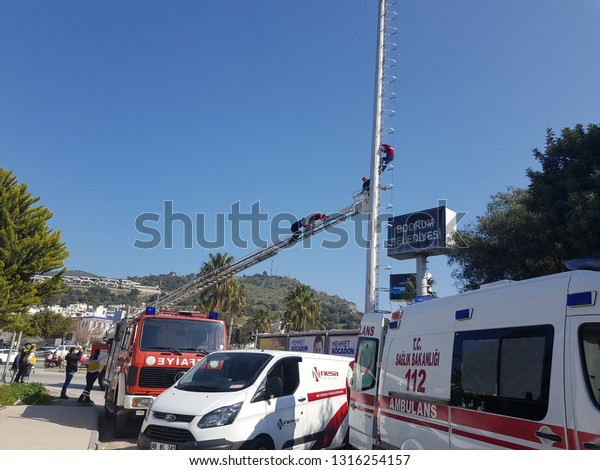 Cevat Şakir\
Mahallesi, Bodrum, Muğla / Turkey - 2 Feb 2019. 112 emergency team\
intervening in an emergency close to Myndos mall. ambulance, police\
and firefighters with fire truck\
crane