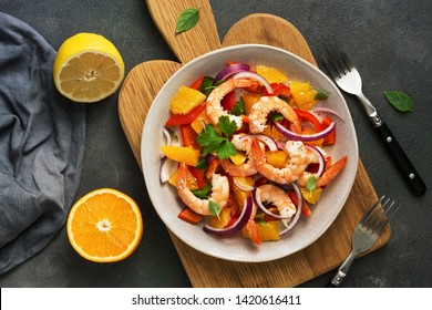 Ceviche With Shrimps And Orange In A Plate On A Cutting Board. Flat Lay, Overhead View