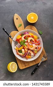 Ceviche With Shrimps And Orange In A Plate On A Cutting Board. Flat Lay, Overhead View