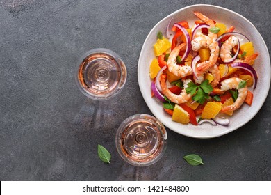 Ceviche With Shrimps And Orange, Two Glasses Of Pink Sparkling Wine, Dark Rustic Background. Top View, Copy Space