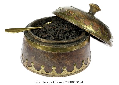 Ceylon Black Tea in a precious wooden bowl isolated on white background
