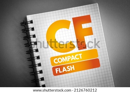 CF - Compact Flash is a flash memory mass storage device used mainly in portable electronic devices, acronym text concept on notepad