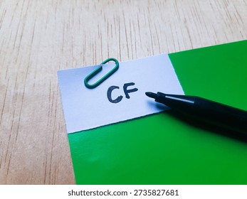 CF writting on table  background. 