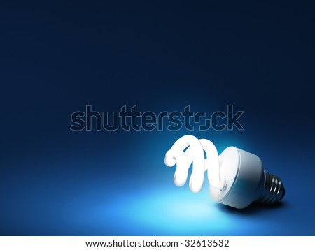 CFL bulb on dark blue backdrop with copy space