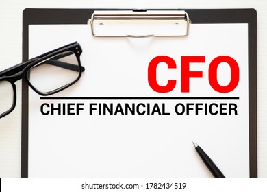 CFO Chief Financial Officer - handwriting on notebook with cup of coffee and pen, acronym business concept