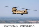 A CH-47 Chinook helicopter assigned to Company B, 3rd Battalion, 238th Aviation Regiment, flies to the Ohio Military Kids Camp Kelleys Island, on Kelleys Island, Ohio, Aug. 8, 2023. 