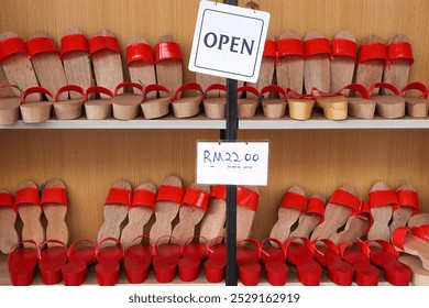 Cha Kiak, wooden clogs, Chinese traditional shoe for sale in Petaling Street Market, the centre of Kuala Lumpur’s original Chinatown.  - Powered by Shutterstock