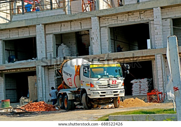 CHACHEANGSOW-THAILAND-APRIL 7 : The concrete mix
truck at work-site on April 7, 2015 Chacheangsow Province,
Thailand