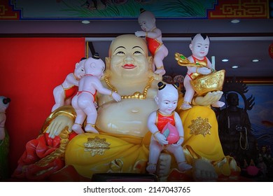 CHACHOENGSAO, THAILAND – APRIL 16, 2022: A Chinese god statue or Buddhist saint on the base at Wat Saman Rattanaram temple in Chachoengsao province of Thailand.