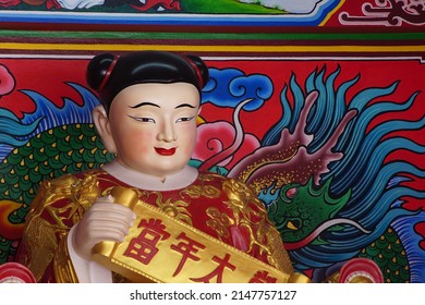 CHACHOENGSAO, THAILAND – APRIL 16, 2022: A Chinese god statue or Buddhist saint on the base at Wat Saman Rattanaram temple in Chachoengsao province of Thailand.
