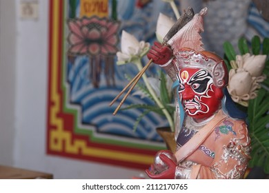 CHACHOENGSAO, THAILAND – JANUARY 23, 2022: A Chinese god statue standing in shrine for selective focus at Wat Saman Rattanaram temple in Chachoengsao province of Thailand.