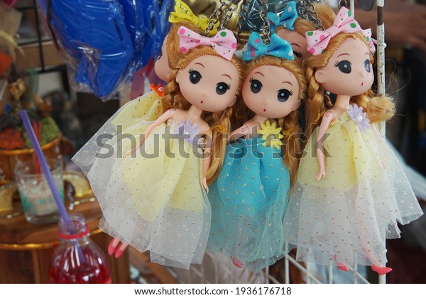 CHACHOENGSAO, THAILAND – MARCH 14, 2021: A key chains of a  cute dolls on hanging ornaments to sold at the local market in Chachoengsao province of Thailand.