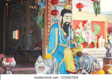 CHACHOENGSAO, THAILAND – MAY 01, 2020: A statue of the Chinese god sitting on tiger in the shrine at Wat Saman Rattanaram Temple in Chachoengsao Province of Thailand.