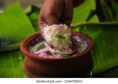 chaddannam indian  famous traditional fermented rice with curd rice,curd rice with onions and chillies in a mud pot closeup with selective focus and blur