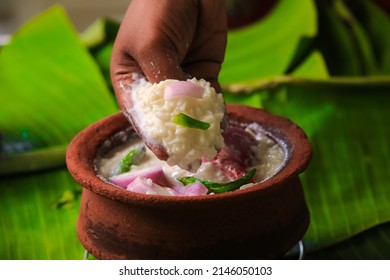 chaddannam indian  famous traditional fermented rice with curd rice,curd rice with onions and chillies in a mud pot closeup with selective focus and blur