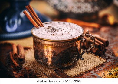Chai tea latte with cinnamon stick