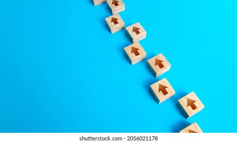 Chain of arrows blocks. Consistency and focus. Concept of conformism, vertical of power. Unchanging course of development. Moving forward. Step by step process. Education and skill growth. - Shutterstock ID 2056021178