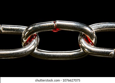 Chain In The Blood Of A Macro Is Isolated On A Black Background, Concept Of Slavery And Imprisonment