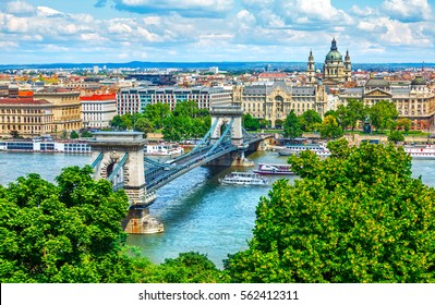 Chain bridge on Danube river in Budapest city. Hungary. Urban landscape panorama with old buildings and domes of opera