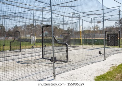 Chain link batting cages in a public baseball park